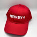 Red cap with STEWBY'S logo.