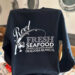 Fishing-themed sweatshirt from Stewby's Seafood, Okaloosa Island.