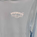 Blue shirt with Stewby's Seafood Shanty logo.