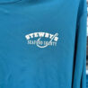 Blue shirt with Stewby's Seafood Shanty logo