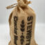 Burlap sack labeled Stewart's Cracker Meal.