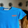 Blue T-shirt with Stewby's Seafood Shanty logo