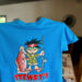 Blue Stewby's t-shirt with cartoon character.
