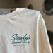 White T-shirt, Stewby's Seafood Shanty logo.