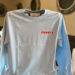 Stewby's light blue long sleeve shirt on display