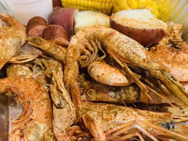 Seafood boil with shrimp, corn, and sausage.