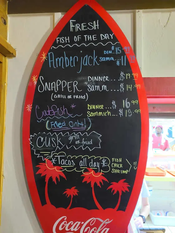 Menu board with fish dishes and prices