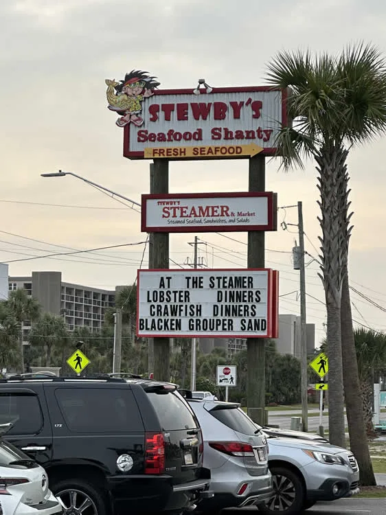 Stewby's Seafood Shanty and Steamer sign with menu.