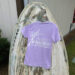 Purple seafood shirt on weathered boat background.
